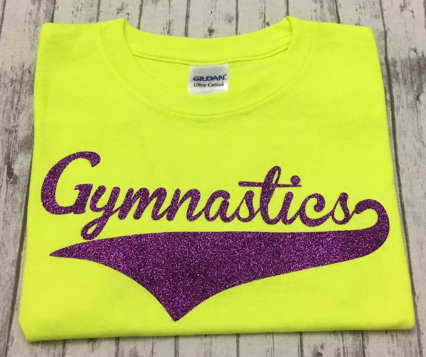 Neon Yellow Gymnastics T-shirt with Purple Glitter Vinyl - Sandy's Bling & Embroidery