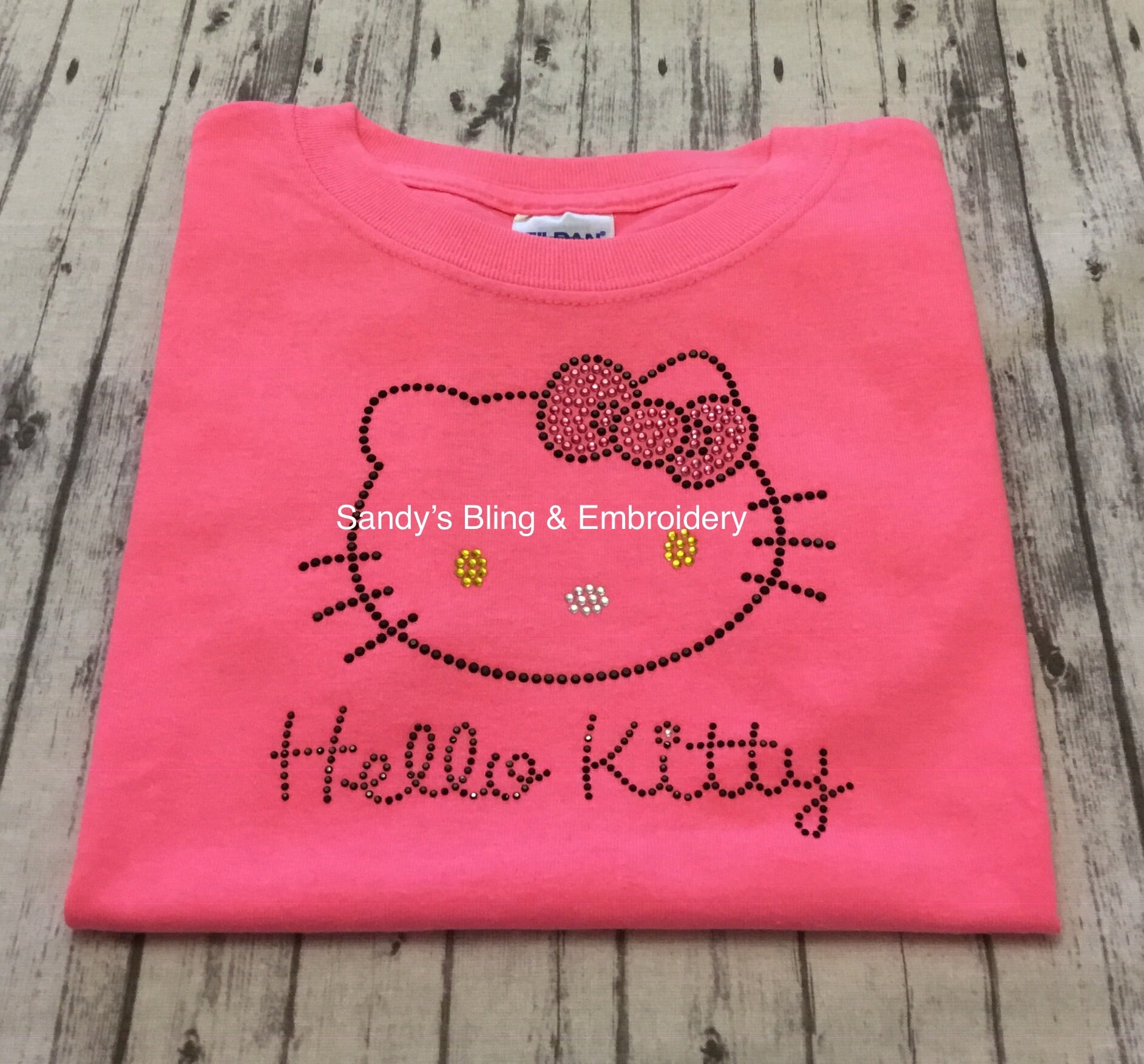 Neon Pink Hello Kitty Face Rhinestone T-shirt - Sandy's Bling & Embroidery