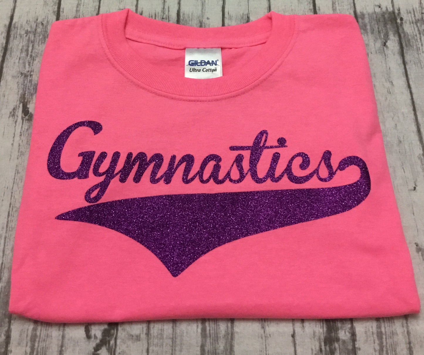 Neon Pink Gymnastics T-shirt with Purple Glitter Vinyl - Sandy's Bling & Embroidery