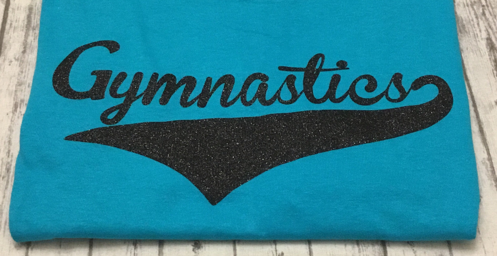 Ladies Medium Turquoise Gymnastics T-shirt with Black Glitter Vinyl - Sandy's Bling & Embroidery